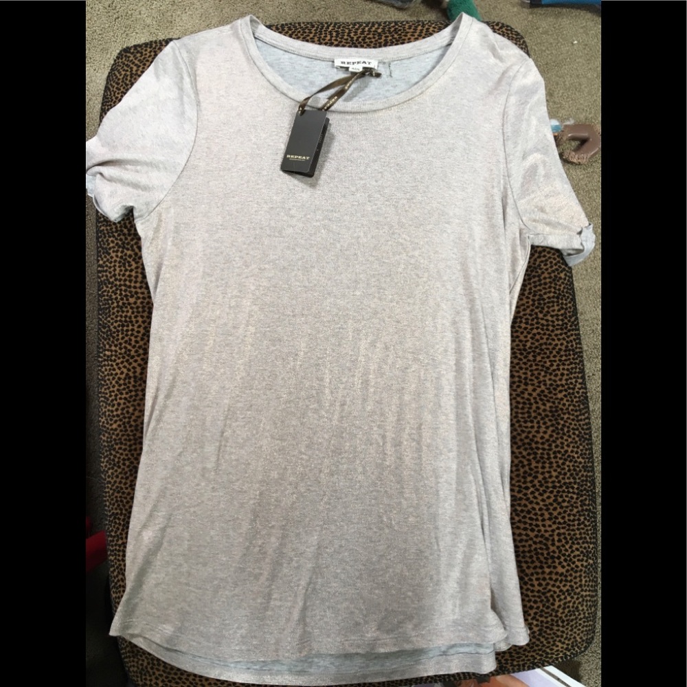 New with tags! Great Metallic Repeat top!